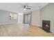 Bright living room with hardwood floors, ceiling fan and fireplace provides a comfortable living space at 1001 Waterwood Dr, Goose Creek, SC 29445