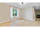 Bright living room with wood floors, a large window, and modern lighting at 1001 Waterwood Dr, Goose Creek, SC 29445