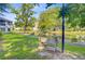 Inviting pond with walking path, bench and mature trees at 1001 Waterwood Dr, Goose Creek, SC 29445
