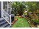 Backyard with artificial grass, a grill, metal stock tank pool and fenced perimeter at 1033 Mathis Ferry Rd, Mount Pleasant, SC 29464