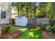 This backyard space features a small shed, seating, and a patch of well-maintained artificial turf at 1033 Mathis Ferry Rd, Mount Pleasant, SC 29464