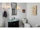 Powder room with modern fixtures, vanity with glass sink, and decorative mirror at 1033 Mathis Ferry Rd, Mount Pleasant, SC 29464