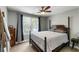 Bedroom featuring a large window, dark wood bed frame, and neutral wall color at 1033 Mathis Ferry Rd, Mount Pleasant, SC 29464