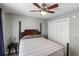 Bedroom with a four-poster bed, ceiling fan, and double door closet at 1033 Mathis Ferry Rd, Mount Pleasant, SC 29464
