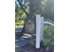 Charming community entrance featuring the 'Queens Row' sign and a traditional white picket fence at 1033 Mathis Ferry Rd, Mount Pleasant, SC 29464