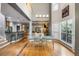 Bright, airy dining room with cathedral ceiling and views of the modern kitchen and fireplace at 1033 Mathis Ferry Rd, Mount Pleasant, SC 29464