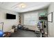 Home gym with black rubber floors, fitness equipment, and natural light at 1033 Mathis Ferry Rd, Mount Pleasant, SC 29464