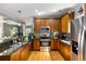 Well-appointed kitchen with stainless steel appliances, granite countertops, and rich wood cabinets at 1033 Mathis Ferry Rd, Mount Pleasant, SC 29464