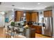Modern kitchen with stainless steel appliances, island with bar seating, and wood cabinets at 1033 Mathis Ferry Rd, Mount Pleasant, SC 29464