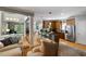 Open-concept living space with a fireplace, kitchen bar, and views of the living room at 1033 Mathis Ferry Rd, Mount Pleasant, SC 29464