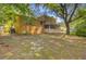 Spacious backyard featuring a brick home, covered patio, chainlink fence, and mature trees at 105 Greendale Ct, Summerville, SC 29485