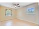 Bedroom with hardwood floors, ceiling fan, and a large window for natural light at 105 Greendale Ct, Summerville, SC 29485