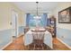 Traditional dining room with hardwood floors, classic furnishings, and natural light from the window at 105 Greendale Ct, Summerville, SC 29485