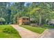 Spacious home with a long driveway, attached garage, and well-maintained lawn at 105 Greendale Ct, Summerville, SC 29485