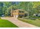 Two-story brick home with an attached two-car garage and long driveway at 105 Greendale Ct, Summerville, SC 29485