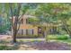 Charming two-story brick home featuring a welcoming front porch and lush landscaping at 105 Greendale Ct, Summerville, SC 29485