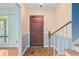 Entryway with hardwood floors, stairs, and paneled wainscoting at 105 Greendale Ct, Summerville, SC 29485