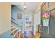 Welcoming foyer featuring hardwood floors, staircase, and charming decor at 105 Greendale Ct, Summerville, SC 29485