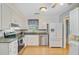 Bright kitchen featuring white cabinets, stainless steel appliances, and granite countertops at 105 Greendale Ct, Summerville, SC 29485