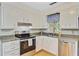 Well-lit kitchen with stainless appliances, granite counters, and white cabinetry at 105 Greendale Ct, Summerville, SC 29485