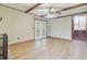 Bright living room with wood beams, a ceiling fan, and a door to a covered patio at 105 Greendale Ct, Summerville, SC 29485