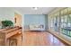 Bright living room featuring large windows, hardwood floors, and stylish furniture at 105 Greendale Ct, Summerville, SC 29485