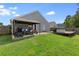 Backyard includes a patio, wooden deck, and ample green space for outdoor enjoyment at 106 Maypop Dr, Goose Creek, SC 29445