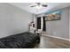 Well lit bedroom with gray walls, ceiling fan, TV and a make up vanity at 106 Maypop Dr, Goose Creek, SC 29445