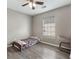 Small bedroom with gray walls, ceiling fan, window, wood look floors and a single bed at 106 Maypop Dr, Goose Creek, SC 29445