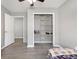 Spare bedroom features a large closet and open doorway with vinyl wood look floors at 106 Maypop Dr, Goose Creek, SC 29445