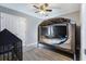 Cozy bedroom features a playpen, crib, light gray walls, ceiling fan and wood look flooring at 106 Maypop Dr, Goose Creek, SC 29445