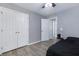 Bedroom with light gray walls, closet and ceiling fan with wood look floors at 106 Maypop Dr, Goose Creek, SC 29445
