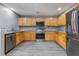 Modern kitchen with wooden cabinets, stainless steel appliances, and granite countertops at 106 Maypop Dr, Goose Creek, SC 29445