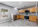 Modern kitchen featuring wooden cabinets, stainless steel appliances, granite countertops, and ample natural light at 106 Maypop Dr, Goose Creek, SC 29445