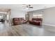 Inviting living room with neutral gray walls, hard wood floors, and comfortable leather furniture at 106 Maypop Dr, Goose Creek, SC 29445