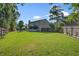 Large backyard featuring a well-maintained lawn, outdoor seating, and mature trees at 106 Sioux Ct, Summerville, SC 29483