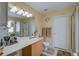 Bright bathroom featuring a vanity with ample lighting, a walk-in shower, and a neutral color scheme at 106 Sioux Ct, Summerville, SC 29483