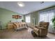 Calm bedroom with a large window, soft colors, and a cozy armchair for relaxation at 106 Sioux Ct, Summerville, SC 29483