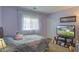 Well-lit bedroom featuring a cozy bed, plush carpet, and a TV for entertainment at 106 Sioux Ct, Summerville, SC 29483