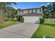 Beautiful two-story home featuring a manicured lawn and an attached two-car garage at 106 Sioux Ct, Summerville, SC 29483