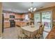 Bright eat-in kitchen with oak cabinets, modern appliances, and sliding door access to the outside at 106 Sioux Ct, Summerville, SC 29483