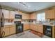 Efficient kitchen featuring ample cabinetry, black appliances, and practical layout for cooking at 106 Sioux Ct, Summerville, SC 29483