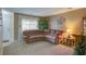Inviting living room with a large sectional sofa, decorative plants, and ample natural light at 106 Sioux Ct, Summerville, SC 29483