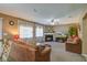 Spacious living room featuring a fireplace, comfortable seating, and a ceiling fan at 106 Sioux Ct, Summerville, SC 29483