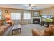 Inviting living room with fireplace, comfortable seating, and natural light filtering through decorative curtains at 106 Sioux Ct, Summerville, SC 29483