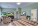 Spacious main bedroom featuring a comfortable armchair, media center, and en-suite bathroom access at 106 Sioux Ct, Summerville, SC 29483