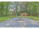 Backyard with a stone fire pit, shed, and a playground at 110 Clubhouse Rd, Summerville, SC 29483