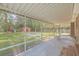 View of a spacious screened-in patio, and backyard with a playground at 110 Clubhouse Rd, Summerville, SC 29483