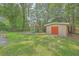 Spacious backyard featuring a shed and a wooden swing set for outdoor enjoyment at 110 Clubhouse Rd, Summerville, SC 29483