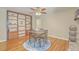Dining room with hardwood floors, built-in shelving, and a fireplace at 110 Clubhouse Rd, Summerville, SC 29483